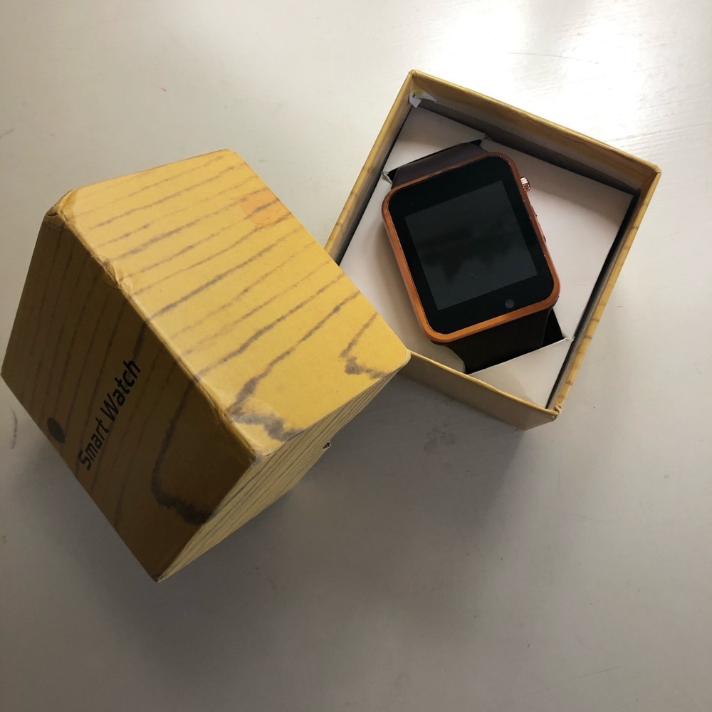 Rose gold smart watch with brown band